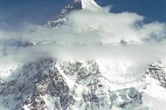 05 Sirdar Ali Naqi On Upper Baltoro Glacier With K2 Behind.jpg